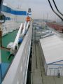 Click for Fullsize. (600 x 800) Finnjet's last day in Rostock. Note the man removing the Silja Line sign from the terminal tent... Photo: Mathias Saken